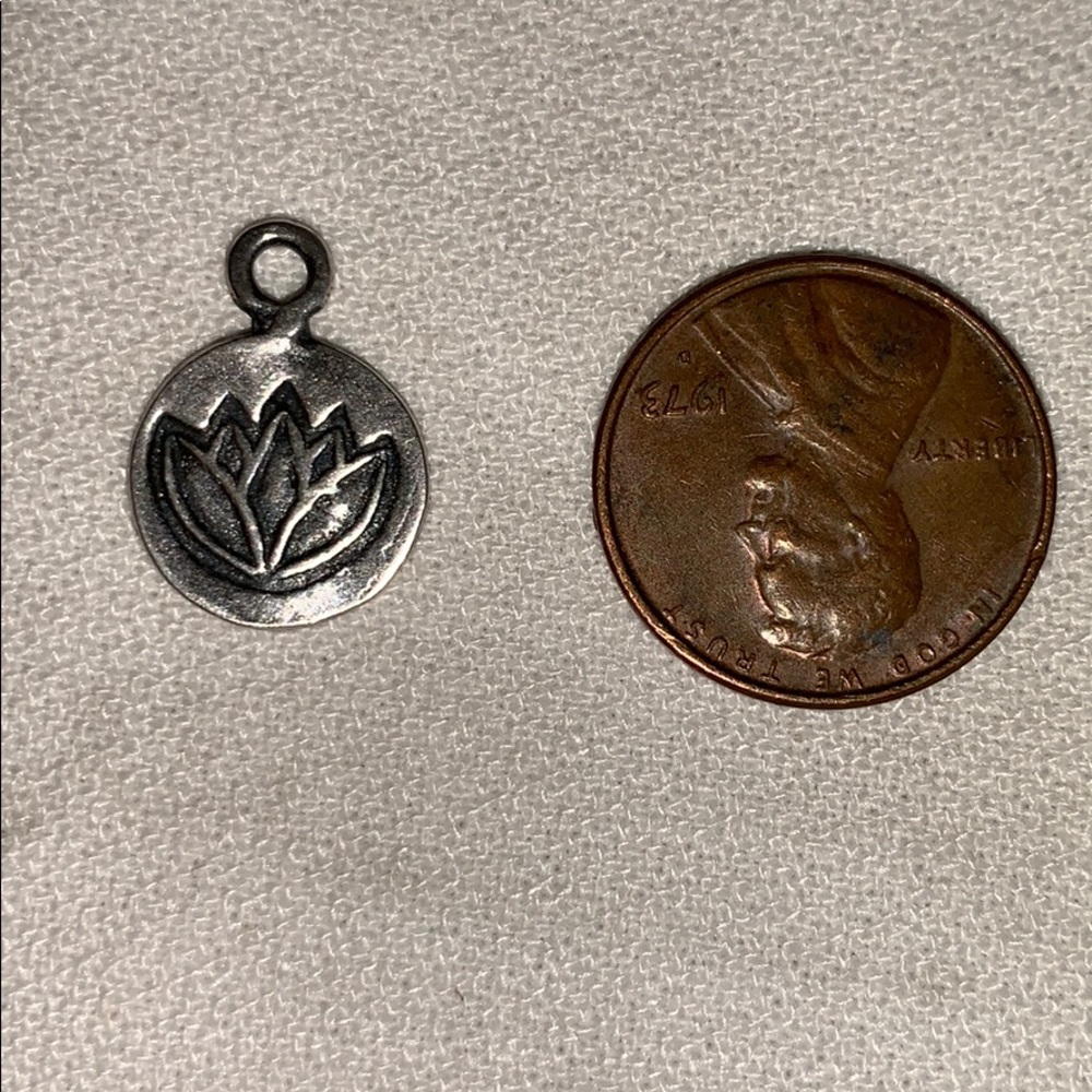 Silver lotus charm